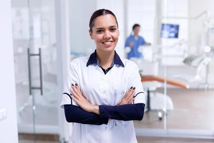 Framed Print : Portrait of cheerful dentist in dental reception Framed Print : Portrait of cheerful dentist in dental reception