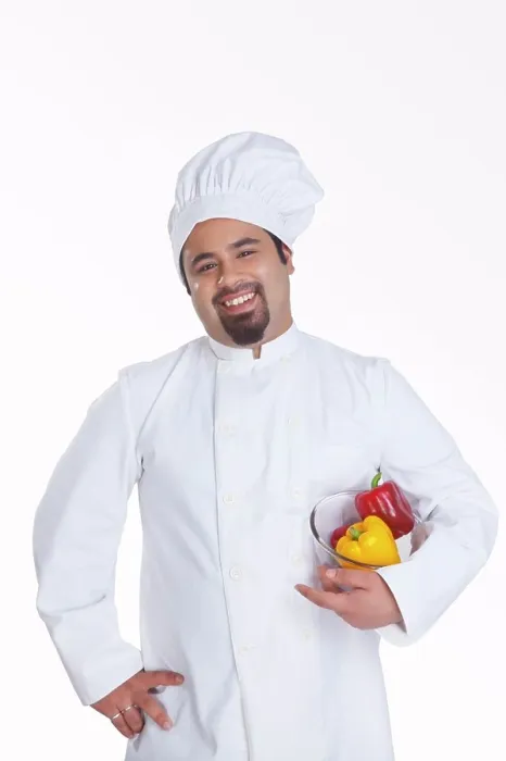 Framed Print : Portrait of chef with bowl of capsicum Framed Print : Portrait of chef with bowl of capsicum
