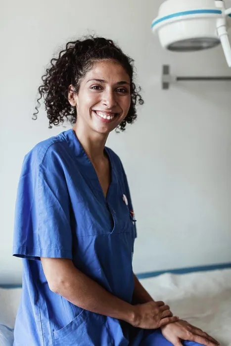 Framed Print : Portrait of confident female doctor sitting in medical clinic Framed Print : Portrait of confident female doctor sitting in medical clinic