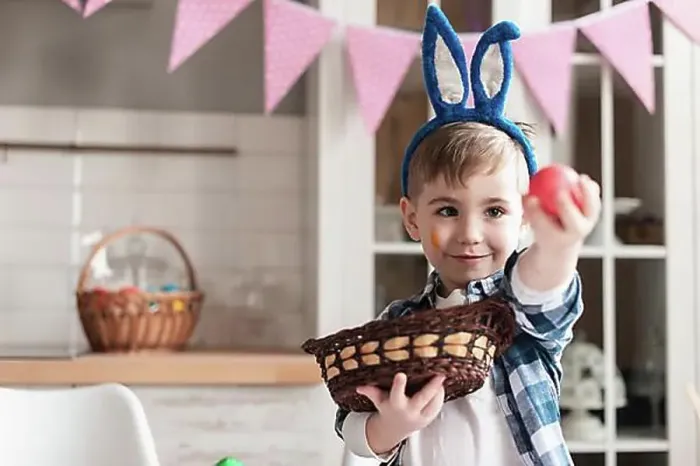 Framed Print : Portrait cute young boy holding easter egg Framed Print : Portrait cute young boy holding easter egg