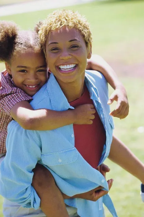 Framed Print : Portrait of a daughter riding piggyback on her mother