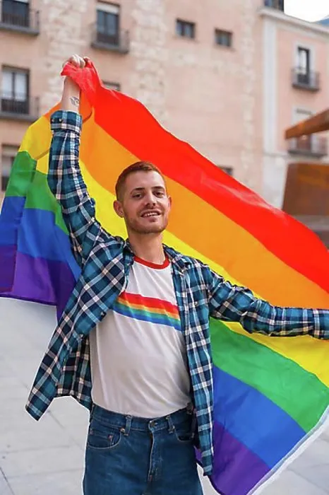 Framed Print : Portrait of gay man with rainbow lgbt flag in the city, pride party and homosexual Framed Print : Portrait of gay man with rainbow lgbt flag in the city, pride party and homosexual