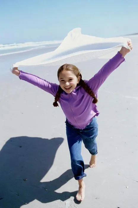 Framed Print : Portrait of a girl running on the beach Framed Print : Portrait of a girl running on the beach