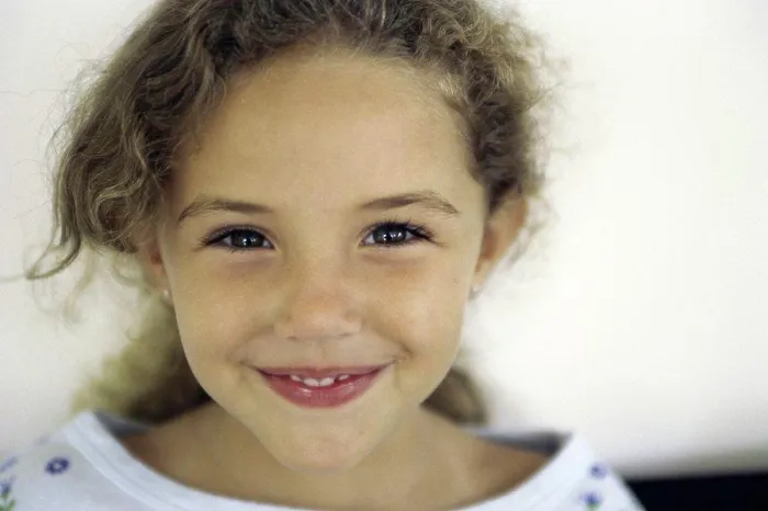 Framed Print : Portrait of a girl smiling Framed Print : Portrait of a girl smiling
