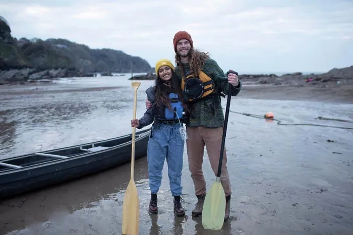 Framed Print : Portrait happy couple with canoe and oars on beach
