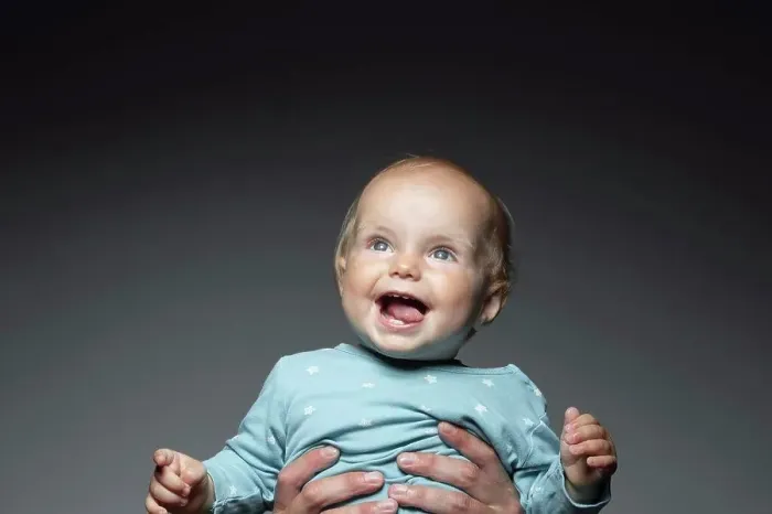 Framed Print : Portrait happy cute baby boy looking up Framed Print : Portrait happy cute baby boy looking up
