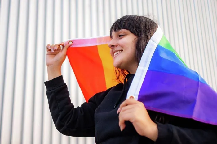 Framed Print : Portrait of a latina woman wearing the rainbow flag Framed Print : Portrait of a latina woman wearing the rainbow flag