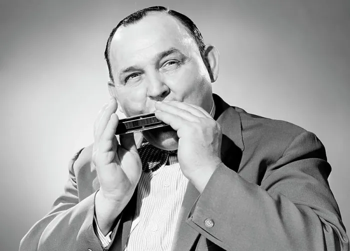 Framed Print : Portrait of man playing on harmonica Framed Print : Portrait of man playing on harmonica