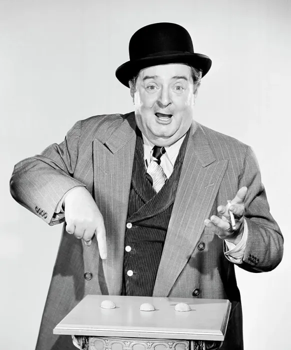 Framed Print : Portrait of a man pointing to nutshells Framed Print : Portrait of a man pointing to nutshells
