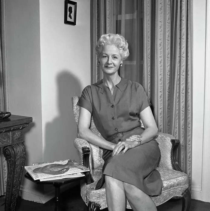 Framed Print : Portrait of mature woman sitting in armchair Framed Print : Portrait of mature woman sitting in armchair