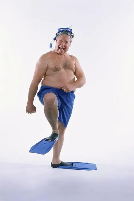Framed Print : Portrait of a mid adult man in shorts wearing flippers with a mask and a snorkel Framed Print : Portrait of a mid adult man in shorts wearing flippers with a mask and a snorkel