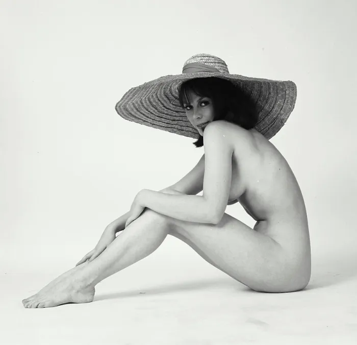 Framed Print : Portrait of a nude young woman wearing a sunhat