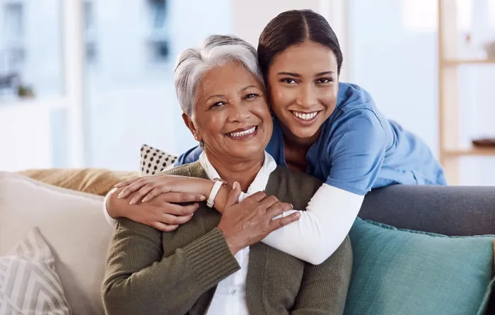 Framed Print : Portrait, smile and nurse hug old woman in retirement house Framed Print : Portrait, smile and nurse hug old woman in retirement house