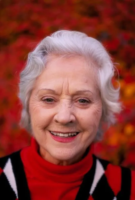 Framed Print : Portrait of a smiling silver-haired senior woman wearing a red white and blue sweater Framed Print : Portrait of a smiling silver-haired senior woman wearing a red white and blue sweater