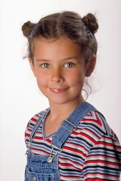 Framed Print : Portrait of Smiling Young Girl in Overalls Framed Print : Portrait of Smiling Young Girl in Overalls