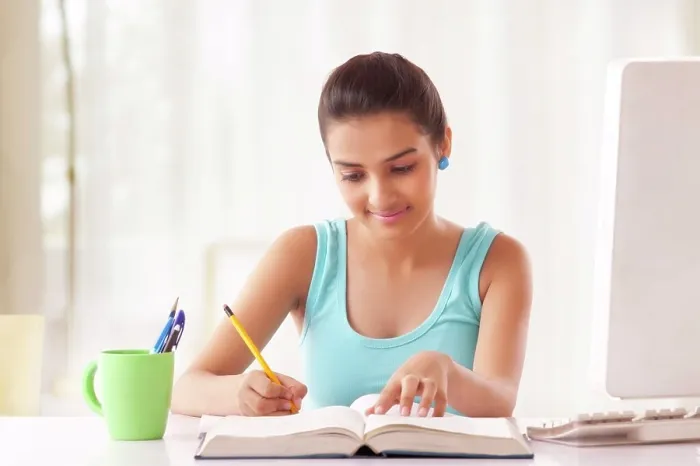 Framed Print : Portrait of Teenage Girls student studying at the table