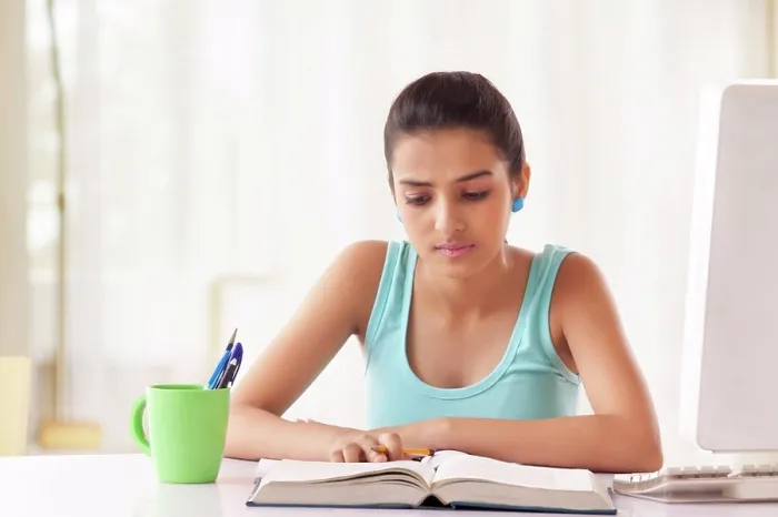 Framed Print : Portrait of Teenage Girls student studying at the table Framed Print : Portrait of Teenage Girls student studying at the table