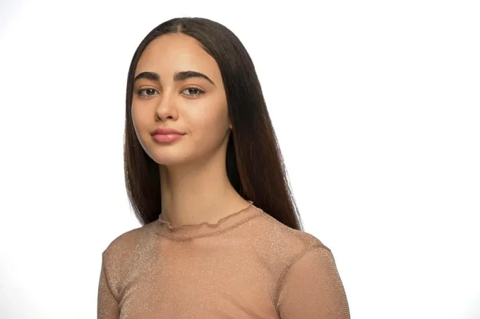 Framed Print : Portrait of young woman of Latin descent looking at camera with slight smile Framed Print : Portrait of young woman of Latin descent looking at camera with slight smile