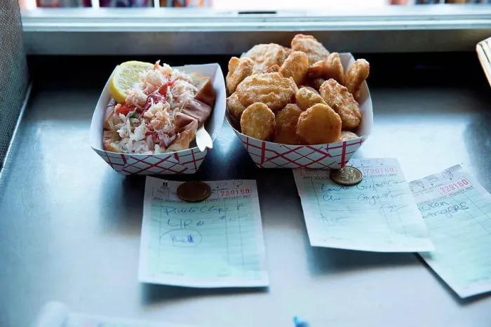 Framed Print : Prepared food by hatch in fast food trailer