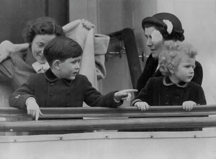 Framed Print : Princess Anne follows the painting finger of Prince Charles on board the new Royal yacht Britannia in Portsmouth Framed Print : Princess Anne follows the painting finger of Prince Charles on board the new Royal yacht Britannia in Portsmouth