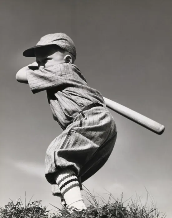 Framed Print : Side profile of a boy swinging a baseball bat