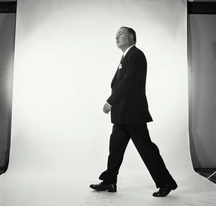 Framed Print : Side profile of businessman walking