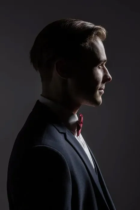 Framed Print : Profile portrait handsome young man in suit with bow tie Framed Print : Profile portrait handsome young man in suit with bow tie