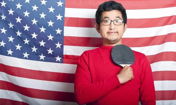 Framed Print : Proud Asian Man holding table tennis paddle against US Flag Framed Print : Proud Asian Man holding table tennis paddle against US Flag