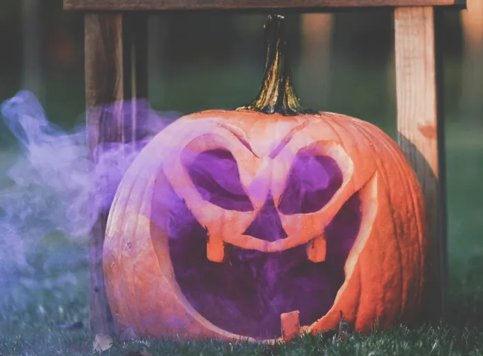 Framed Print : Purple smoke in Jack o Lantern pumpkin face for Halloween holiday Framed Print : Purple smoke in Jack o Lantern pumpkin face for Halloween holiday