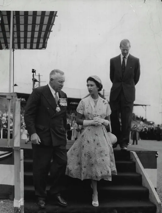 Framed Print : Rally: The Queen descends the dais with Major General Richardson after the Duke (in background) Framed Print : Rally: The Queen descends the dais with Major General Richardson after the Duke (in background)