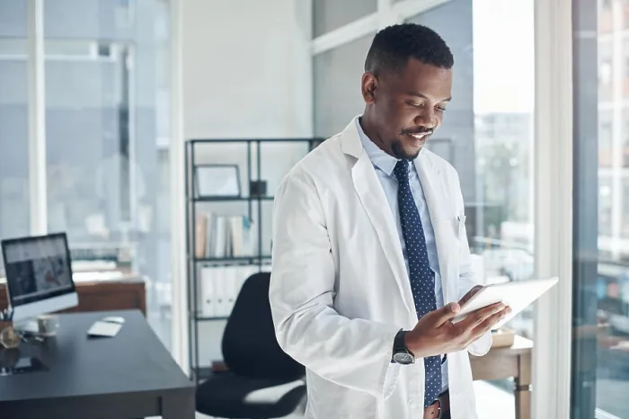 Framed Print : Reading, doctor and black man with tablet Framed Print : Reading, doctor and black man with tablet