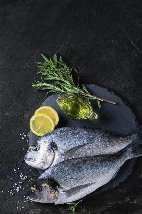 Framed Print : Two ready to cook raw bream fish with herbs Framed Print : Two ready to cook raw bream fish with herbs