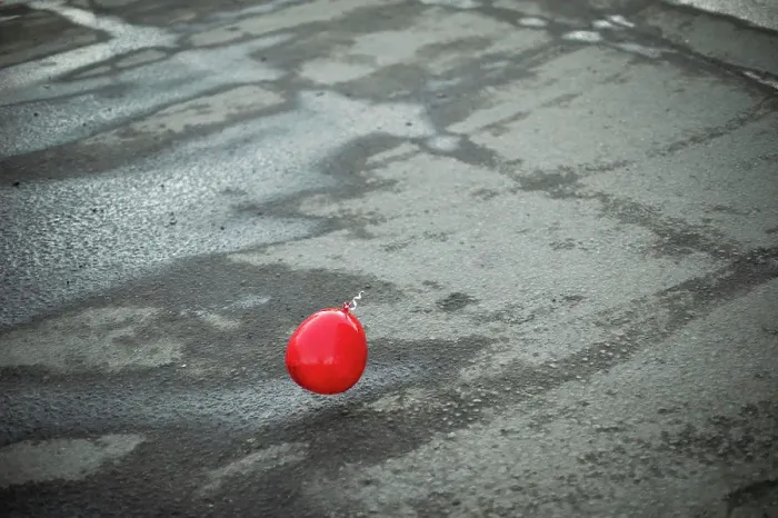 Framed Print : Red ball flies over asphalt. Balloon outside Framed Print : Red ball flies over asphalt. Balloon outside