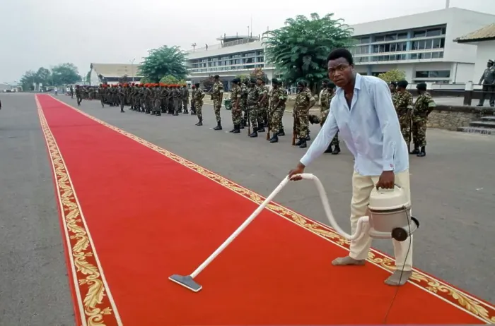 Framed Print : Red carpet being cleaned ready for VIP arrival in Cameroon, West Africa Framed Print : Red carpet being cleaned ready for VIP arrival in Cameroon, West Africa