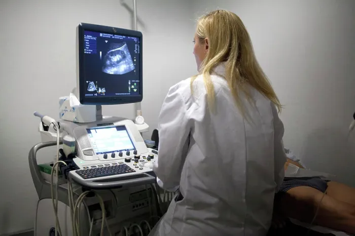 Framed Print : Reportage in a radiology centre in Haute-Savoie, France. A technician carries out a scan of the kidneys and prostate Framed Print : Reportage in a radiology centre in Haute-Savoie, France. A technician carries out a scan of the kidneys and prostate