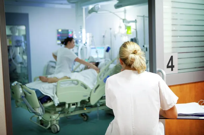 Framed Print : Reportage in Robert Ballanger hospital's Intensive Care Unit in France. A nurse notes down a patient's vital parameters Framed Print : Reportage in Robert Ballanger hospital's Intensive Care Unit in France. A nurse notes down a patient's vital parameters