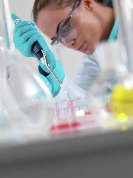 Framed Print : Researcher pipetting liquid Framed Print : Researcher pipetting liquid