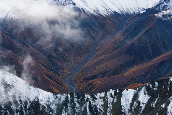 Framed Print : River flowing through fall colored mountains, Kluane National Park, Haines Junction, Yukon, Canada