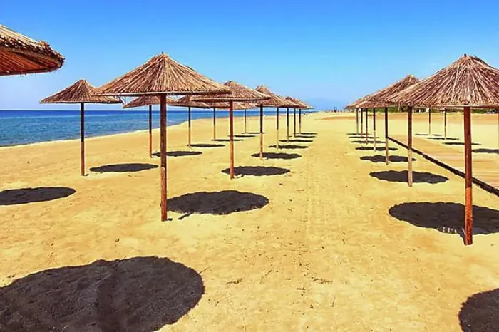 Framed Print : Row of wooden umbrellas at sandy beach, sea and blue sky vacation background, Greece, Europe Framed Print : Row of wooden umbrellas at sandy beach, sea and blue sky vacation background, Greece, Europe