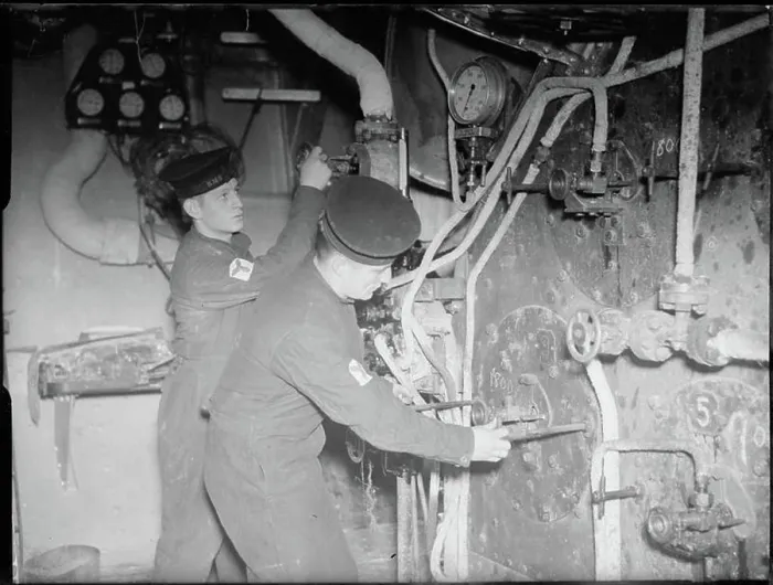 Framed Print : The Royal Navy during the Second World War A scene in the boiler room of a cruiser showing two stokers checking Framed Print : The Royal Navy during the Second World War A scene in the boiler room of a cruiser showing two stokers checking
