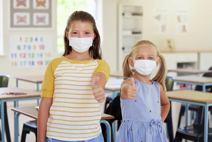 Framed Print : School kids, thumbs up and healthy students wearing masks in a classroom protecting against covid