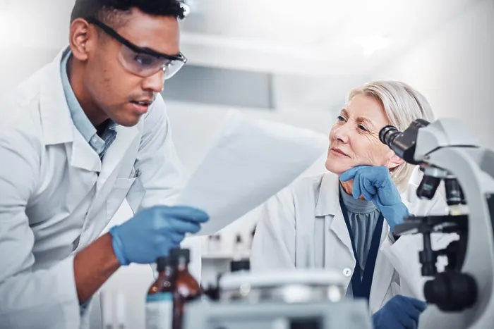 Framed Print : Science, research and team with documents in laboratory for analytics report Framed Print : Science, research and team with documents in laboratory for analytics report