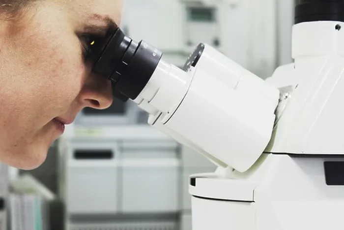 Framed Print : Scientist looking through microscope Framed Print : Scientist looking through microscope