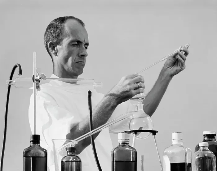 Framed Print : Scientist mixing chemicals in laboratory Framed Print : Scientist mixing chemicals in laboratory
