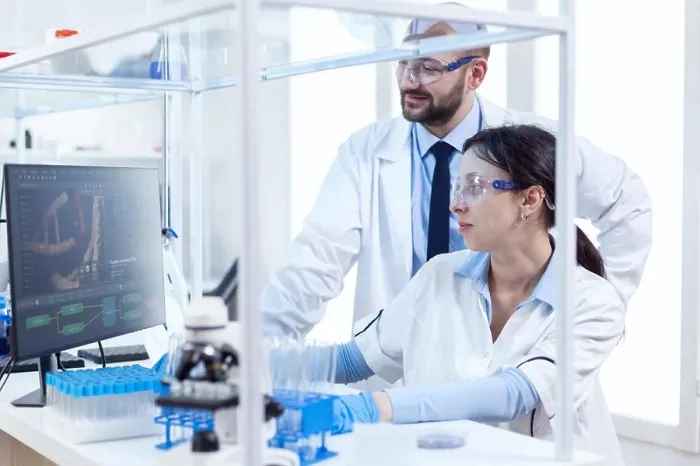 Framed Print : Two scientists are working together in laboratory Framed Print : Two scientists are working together in laboratory