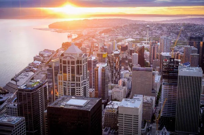 Framed Print : Seattle Skyline At Sunset With Sun Peaking Through The Clouds Framed Print : Seattle Skyline At Sunset With Sun Peaking Through The Clouds