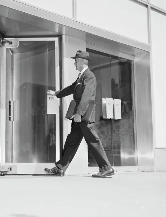 Framed Print : Senior businessman entering office building Framed Print : Senior businessman entering office building