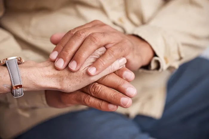 Framed Print : Senior couple holding hands for support