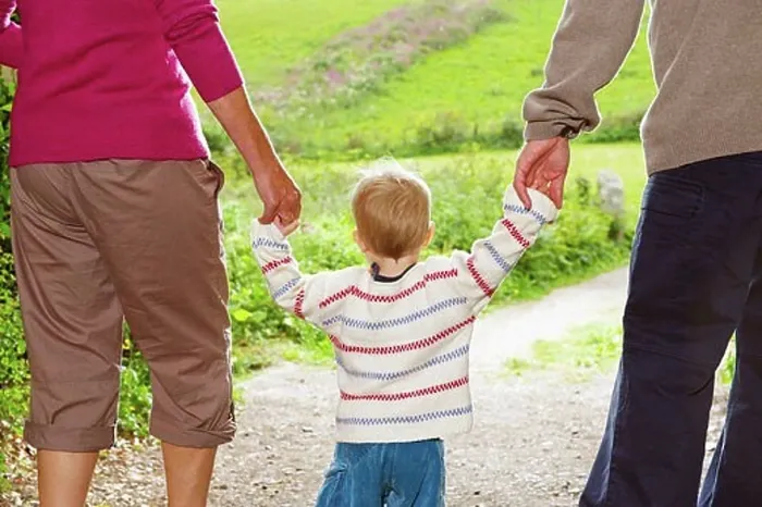 Framed Print : Senior couple walking with child Framed Print : Senior couple walking with child