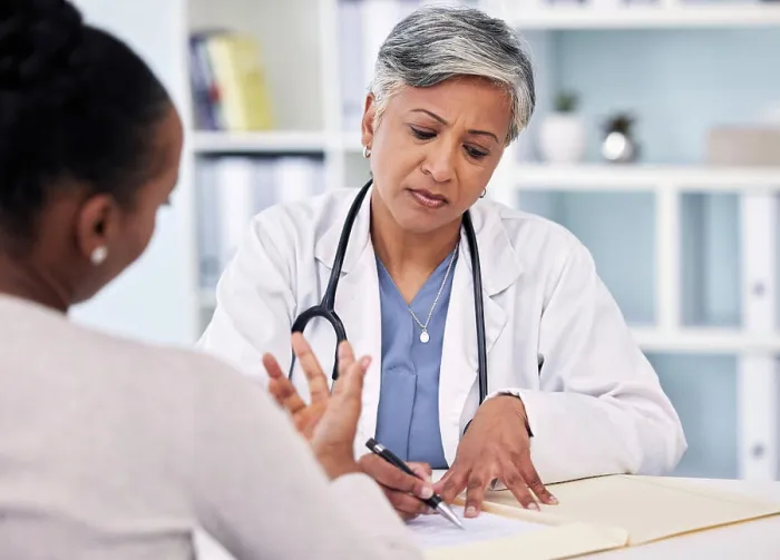Framed Print : Senior doctor, patient and writing prescription Framed Print : Senior doctor, patient and writing prescription